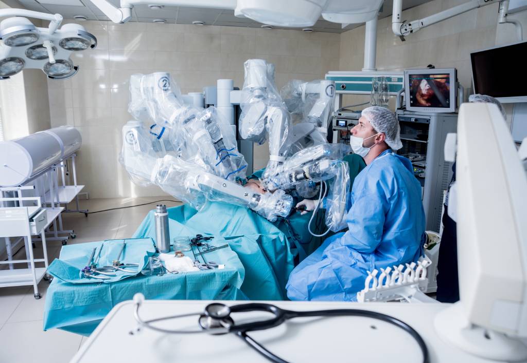 A surgeon conducts a laparoscopic procedure on a patient