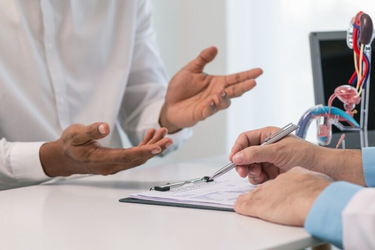 A patient and physician discuss a prostate cancer diagnosis.  